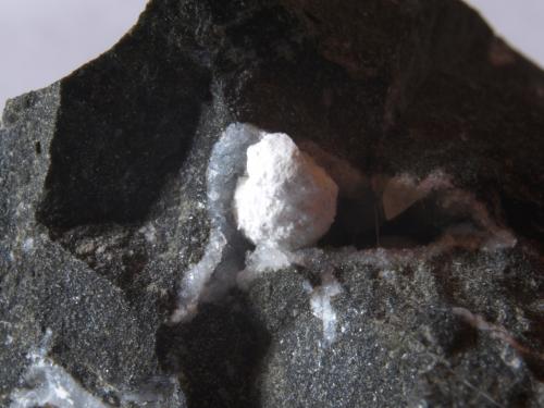 Tacharanite